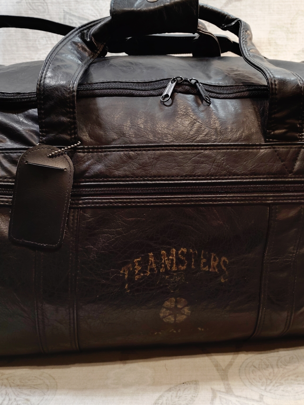 Black Leather Duffel Bag With Teamster Logo Lightly Printed